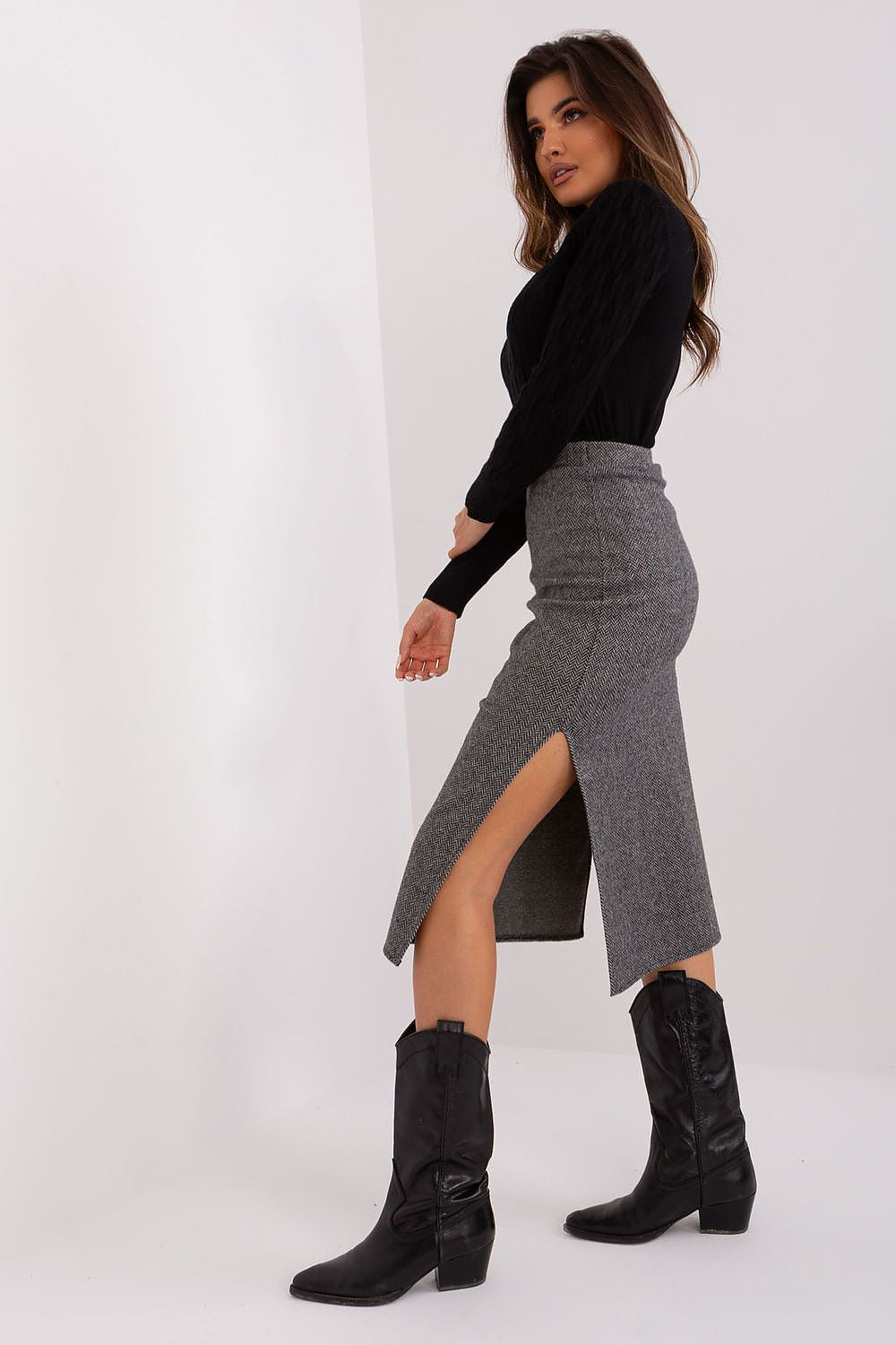 Model wearing Lakerta's elegant midi knit skirt, perfect for office or casual settings, highlighting its comfort and style.