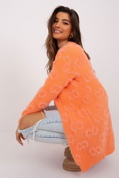 Warm and stylish knit cardigan with pockets from AT, perfect for layering in casual chic outfits.