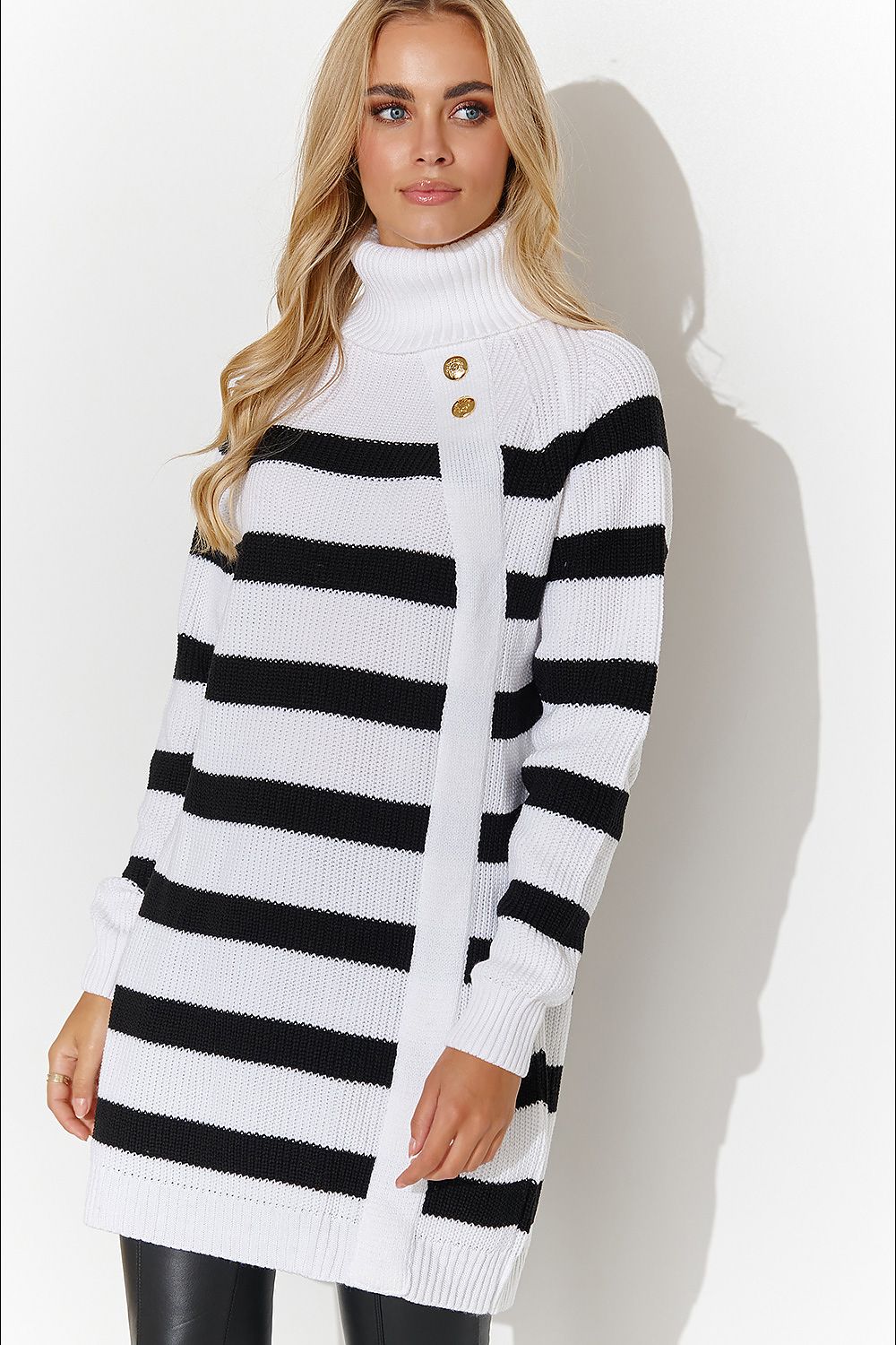 Elegant Makadamia turtleneck sweater with gold buttons, perfect for social gatherings or formal outings, showcasing a loose cut for comfort and style.