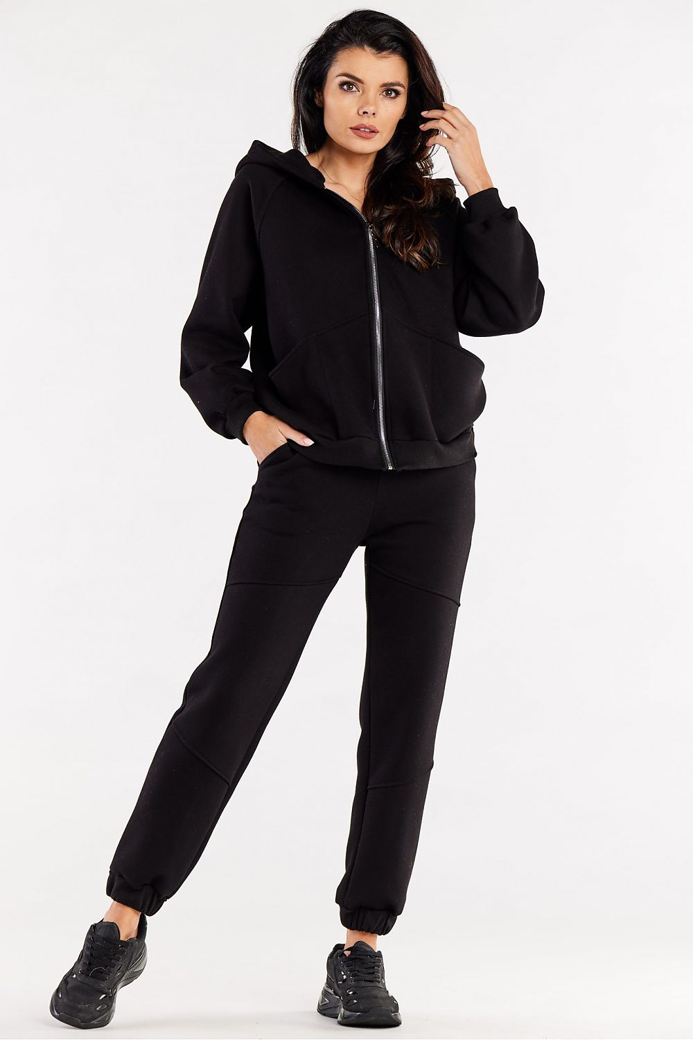 Model wearing Luxury Loose Sweatpants with Decorative Stitching and Elastic Waist by Infinite You, epitomizing comfort and style.