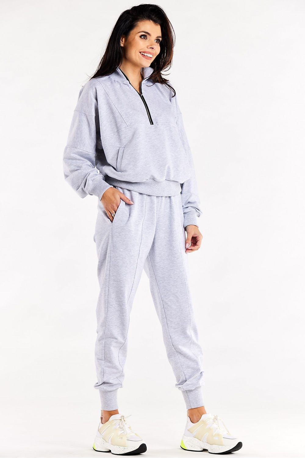 Luxury Loose Tracksuit Trousers with Decorative Seams and Ribbed Cuffs by Infinite You - Side view highlighting the stylish slip pockets and ribbed cuffs.