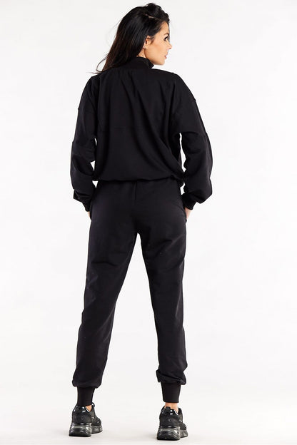 Close-up of Luxury Loose Tracksuit Trousers with Decorative Seams and Ribbed Cuffs by Infinite You, highlighting the soft cotton and spandex fabric.