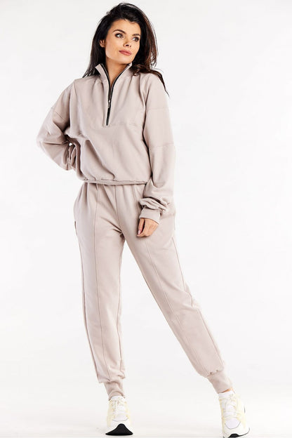 A model wearing Luxury Loose Tracksuit Trousers with Decorative Seams and Ribbed Cuffs by Infinite You, exuding comfort and luxury.