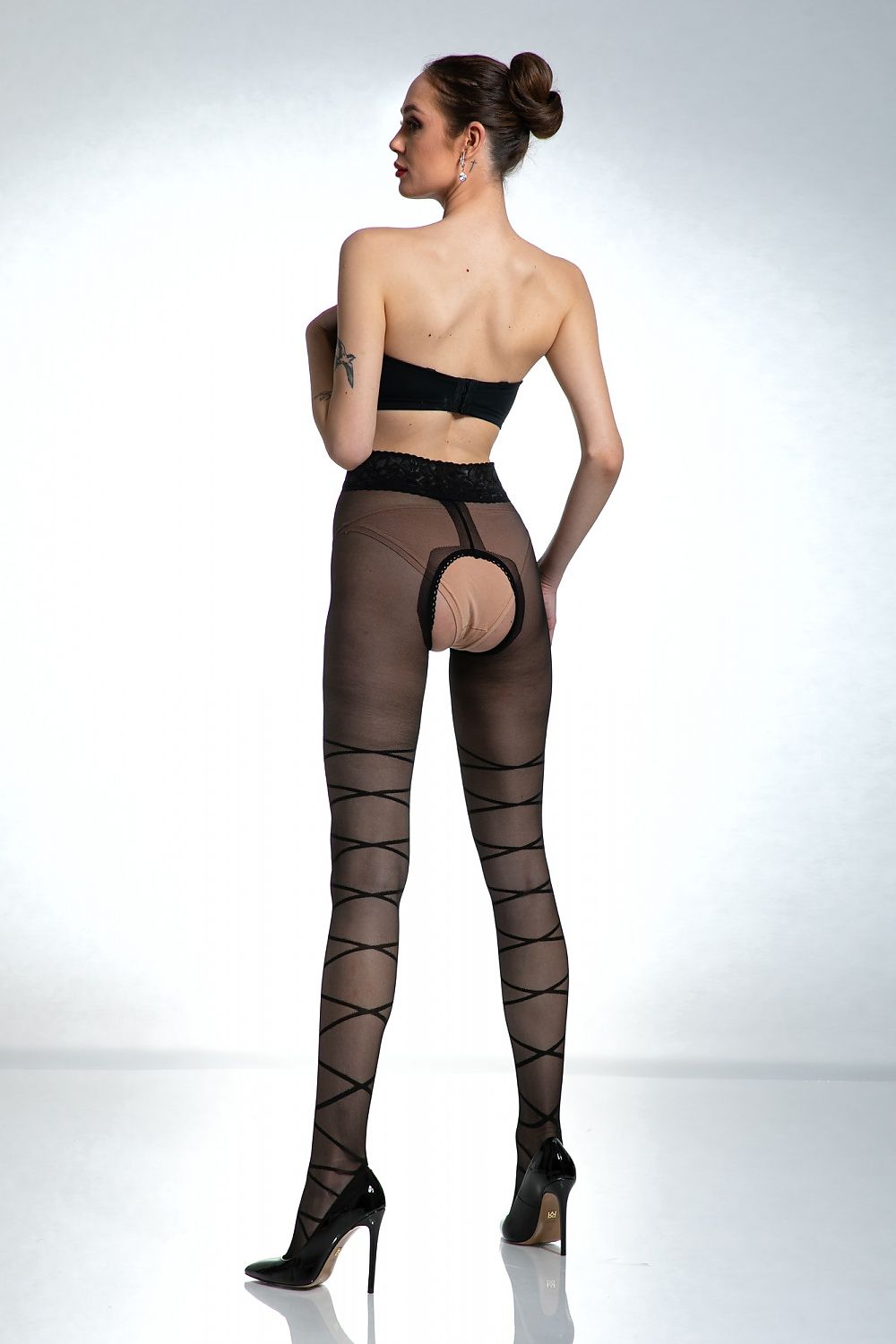 Luxurious Dominatrice Tights by Amour showcasing intricate Italian bondage style design with elegant lace and silicone trim, perfect for confident women seeking to express their individuality.