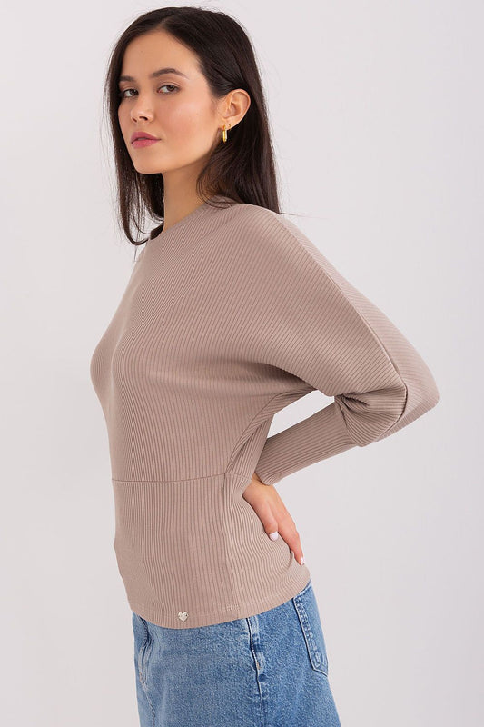 Elegant Batwing Cotton Blouse featuring a comfortable fit and distinctive ribbed fabric, perfect for casual occasions and workplace settings.