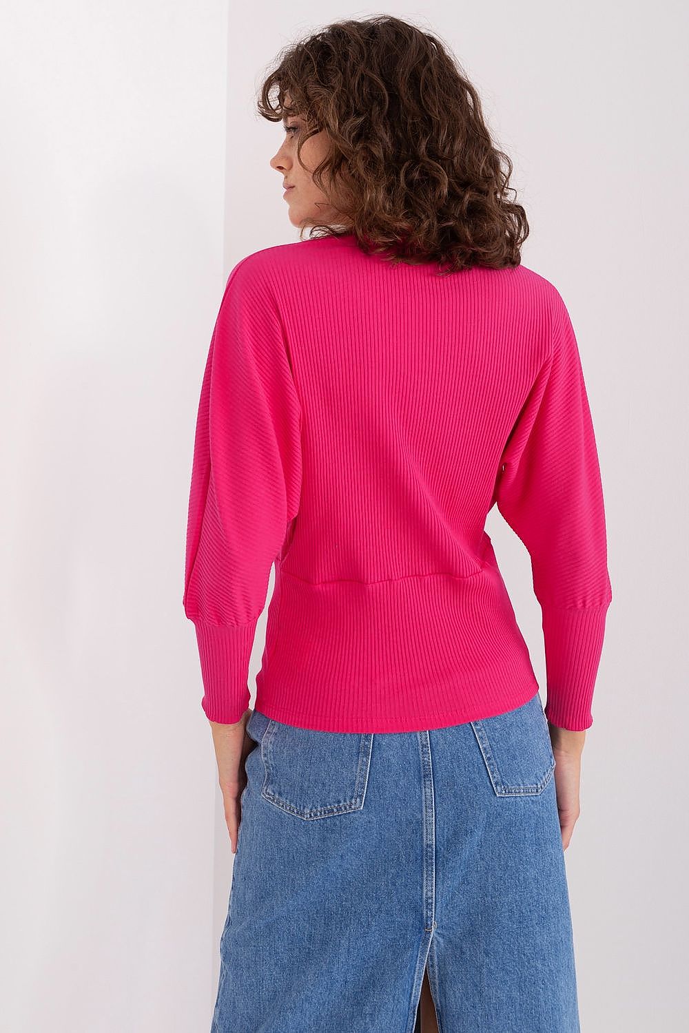 Elegant Batwing Cotton Blouse with Unique Ribbed Texture and Comfortable Fit for Everyday Wear, highlighting the blouse's loose cut and breathable fabric.