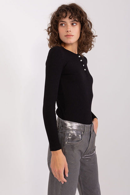 Close-up of the stunning button fastening with zircons on an elegant cotton blouse by BFG, showcasing sophisticated style.