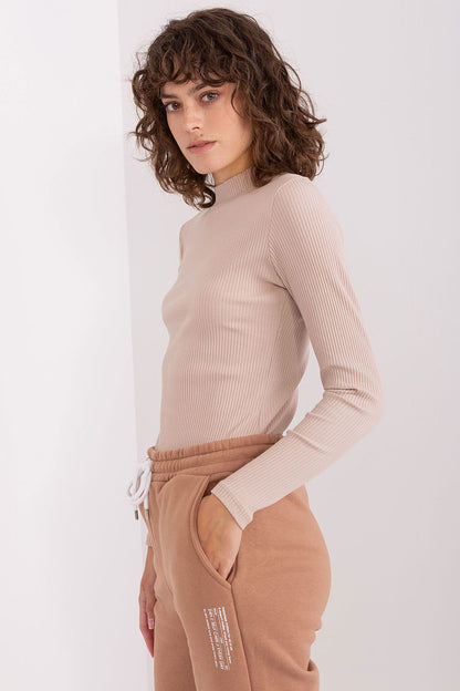 Fitted BFG ribbed cotton blouse available in various sizes, offering effortless style for day-to-night transitions.
