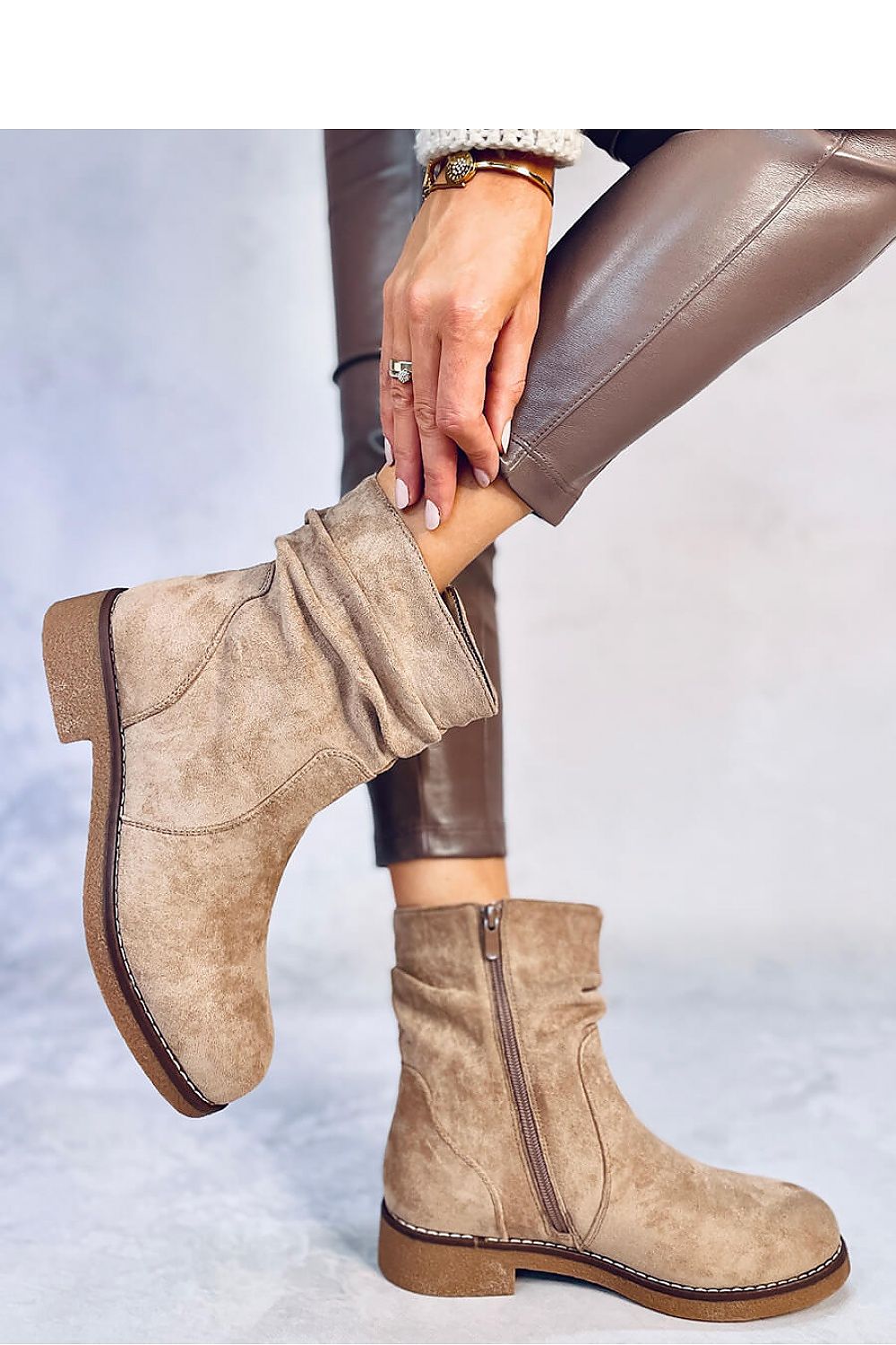 Chic women's eco-suede boots by Inello, showcasing a convenient zipper detail and a classic design on a 3 cm heel.