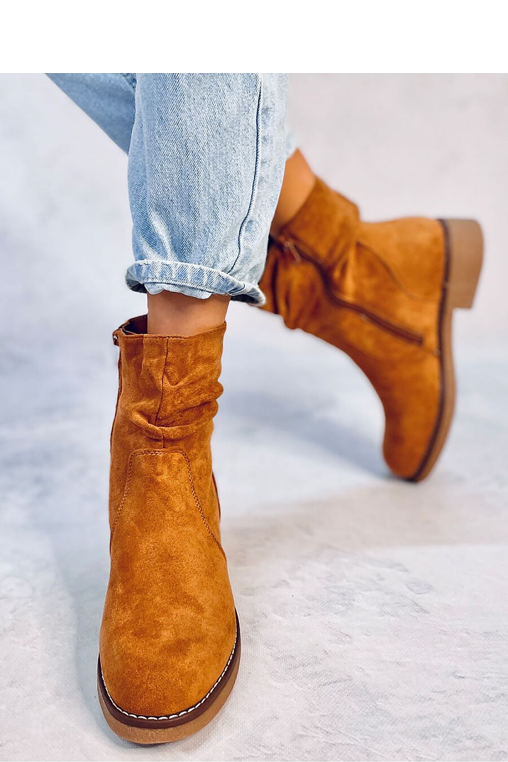 Elegant Women's Eco-Suede Boots by Inello featuring a soft fur lining and stylish zipper closure, ideal for luxurious winter fashion.