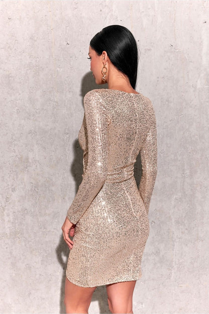 Close-up of the luxurious sequins on the mini dress by Roco Fashion, showcasing the exquisite craftsmanship and sophisticated design.