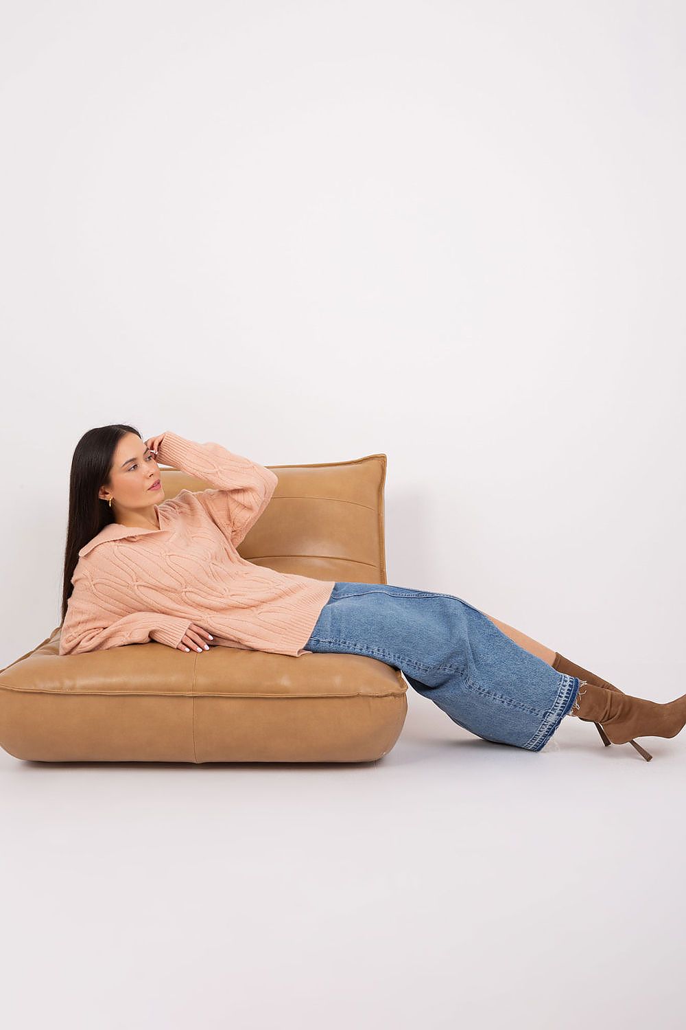 Close-up of the soft acrylic fabric of the women's long sleeve sweater by AT, highlighting its exquisite texture and elegant design.