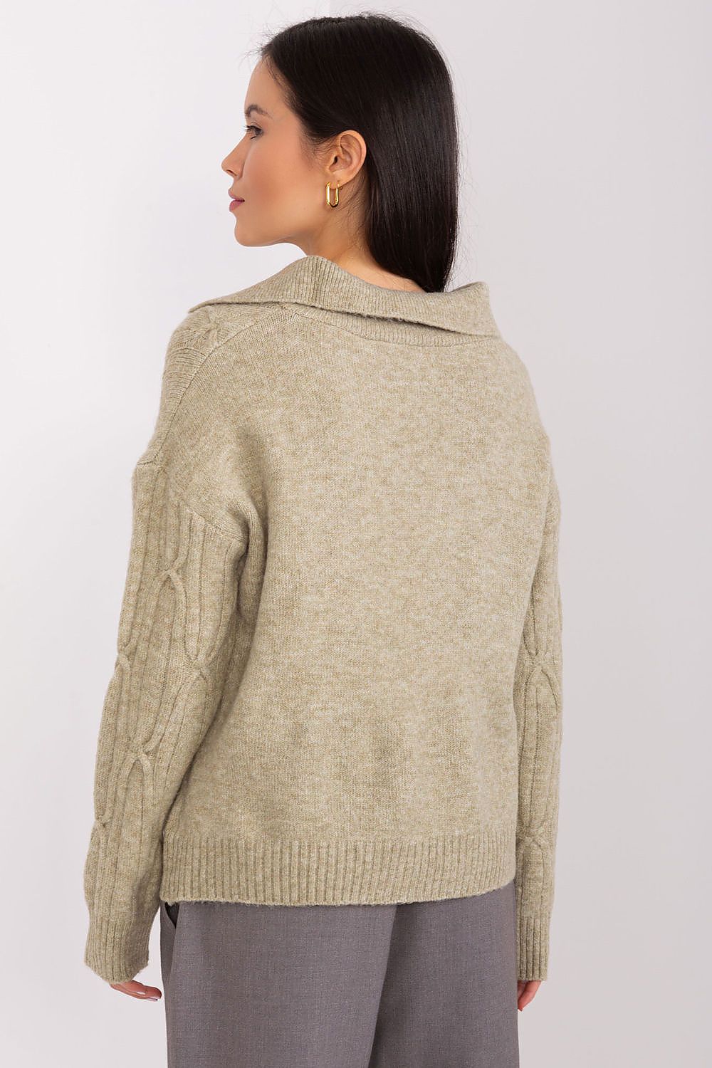 Elegant AT women's sweater with long sleeves, showcasing its soft acrylic blend and timeless style, perfect for versatile layering.