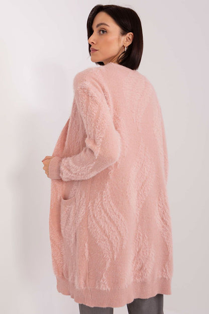 Elegant long sleeve bedspread cardigan by AT draped stylishly, emphasizing comfort and luxury for cooler days.