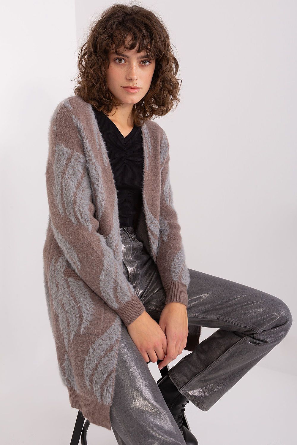 Luxurious long sleeve bedspread cardigan by AT in variegated fabric, featuring convenient pockets for everyday style.