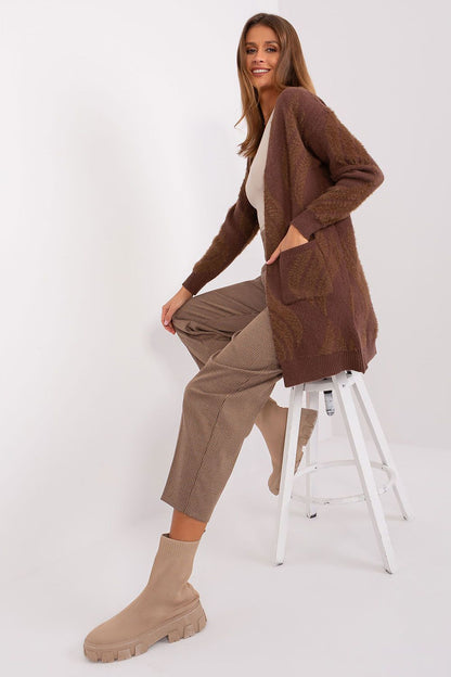 Elegant variegated fabric cardigan by AT featuring long sleeves and practical slip pockets for functionality and warmth.