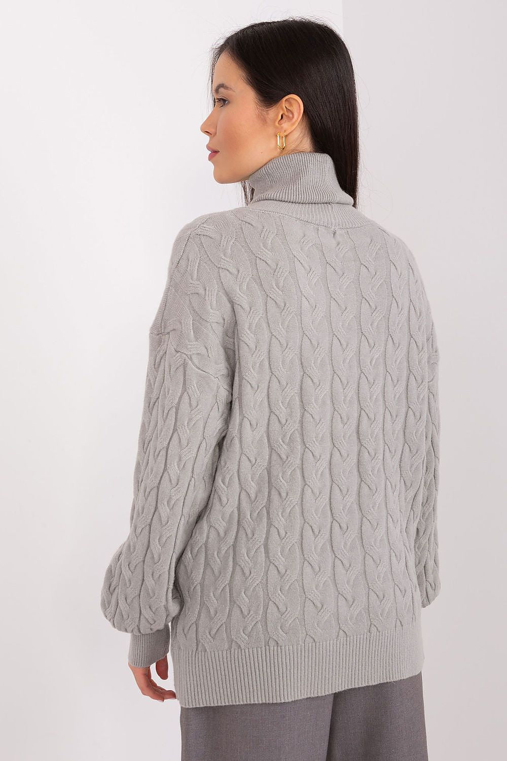 Flat lay of the elegant plaid turtleneck sweater for women by AT, highlighting its beautiful design and detailed weave in a fashionable setting.