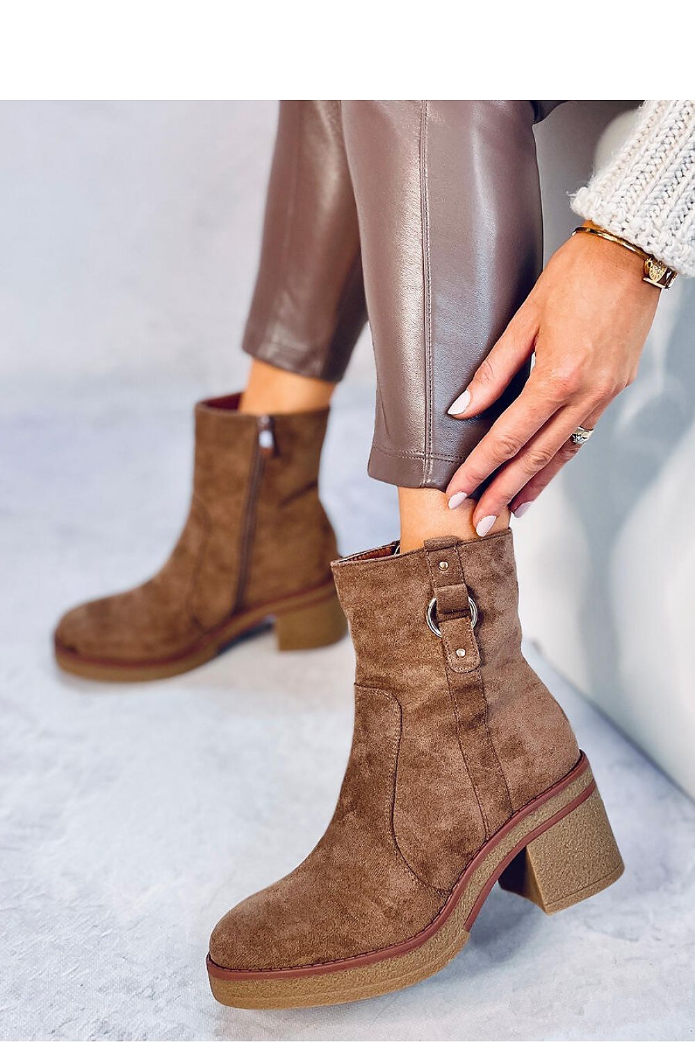 Elegant eco-suede heel boots by Inello featuring a 7 cm high heel and a luxurious soft fur lining, perfect for a stylish and warm winter look.