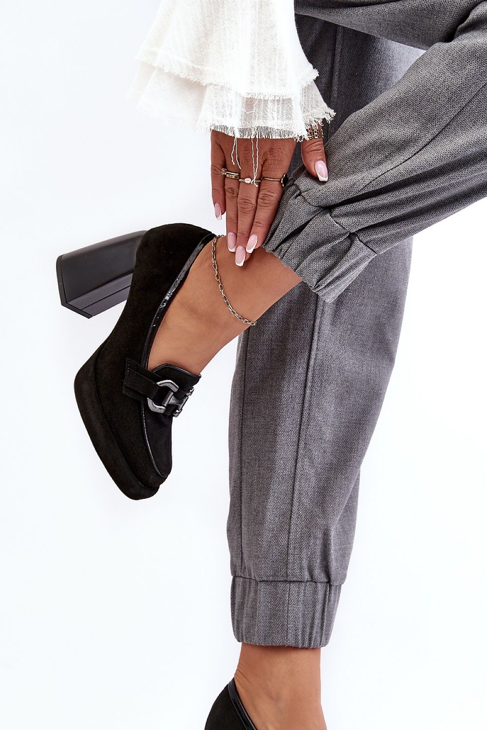 Elegant natural leather block heel pumps for women by Step in Style, designed with a stylish rounded toe and adorned with a decorative ornament.