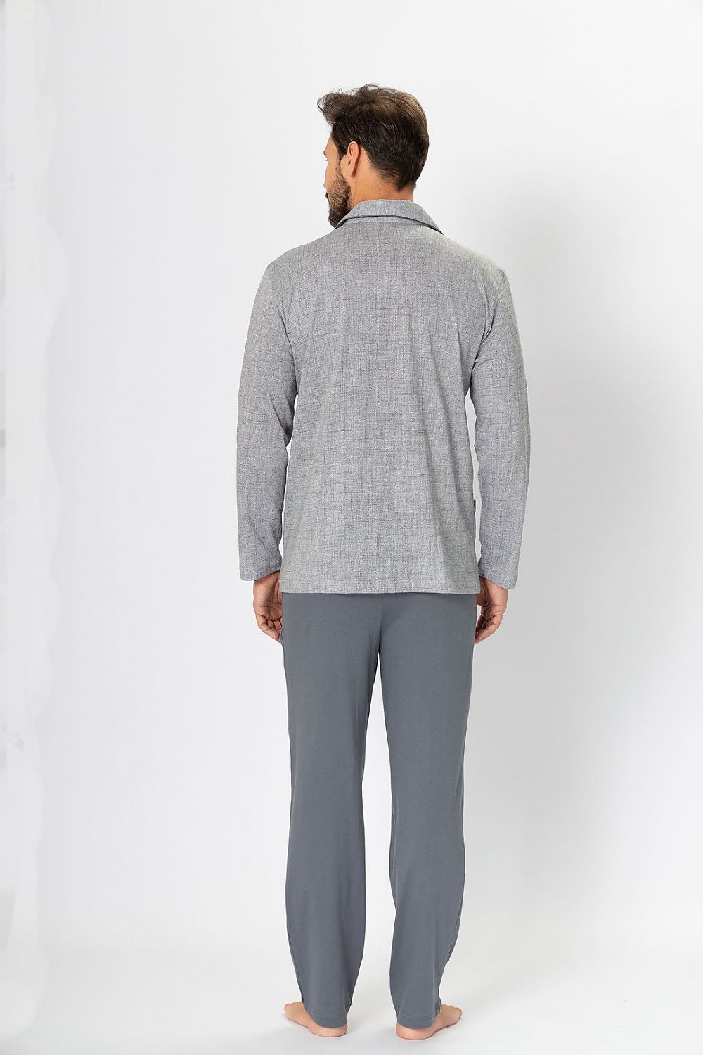 M-Max men's pyjamas set displayed on a hanger, highlighting the vibrant patterns and premium cotton fabric, designed for upscale relaxation.