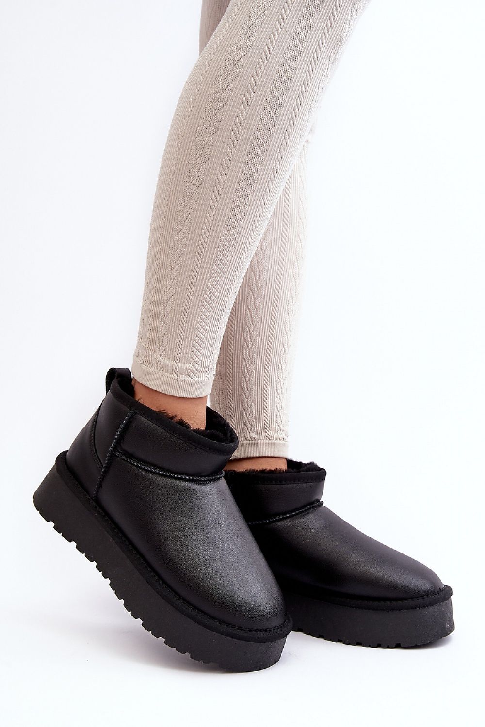 Luxury women's snow boots crafted in natural leather with sumptuous fur insulation, designed by Step in Style, featuring a durable rubber platform for elegance and comfort.