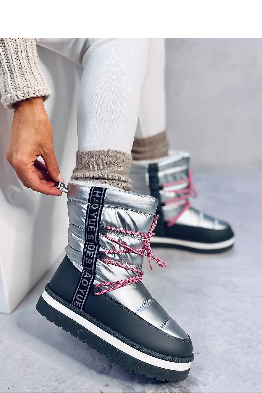 Elegant Inello Women's Snow Boots showcasing orthalion fabric and thick fur insulation for luxury winter styling.