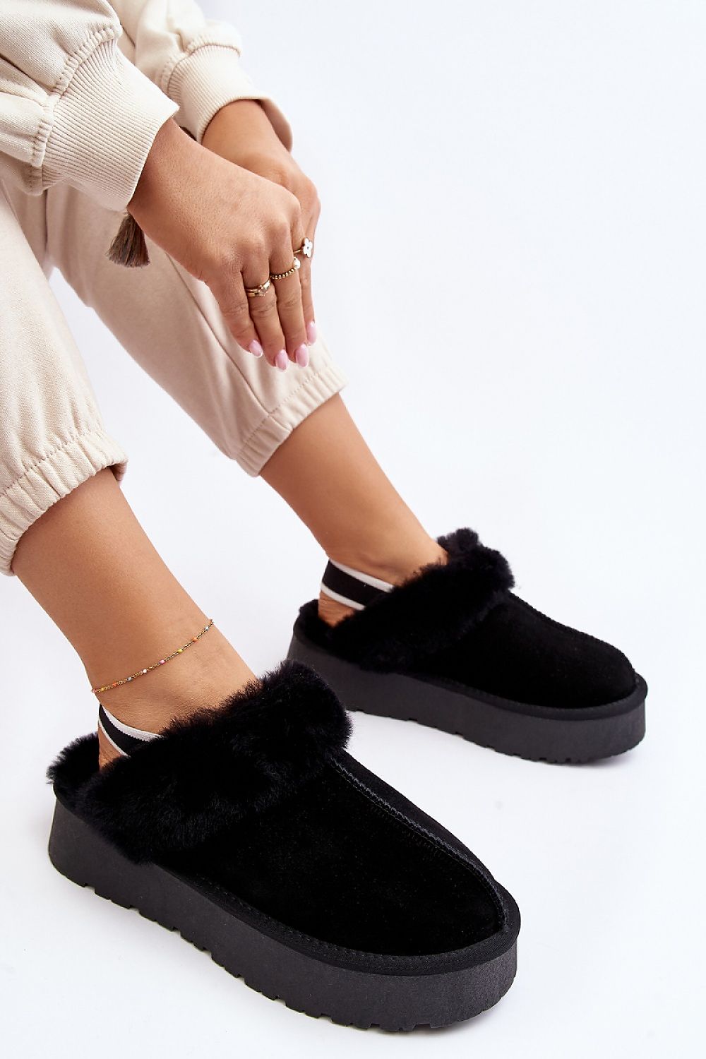Luxurious women's suede slippers by Step in Style, featuring thick fur insulation and a stylish rubber platform.