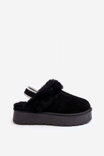 Elegant design of Step in Style women's suede slippers showcasing plush fur interior and secure elastic band for comfort.
