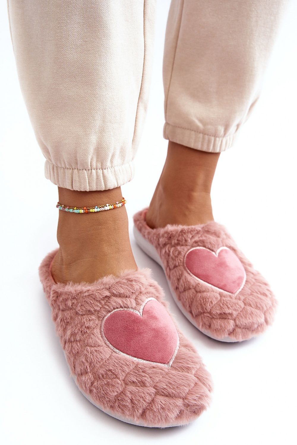 Chic luxury INBLU pink slippers, designed for sensitive feet with a soft fur finish and heart detail, offering superior comfort by Step in Style.
