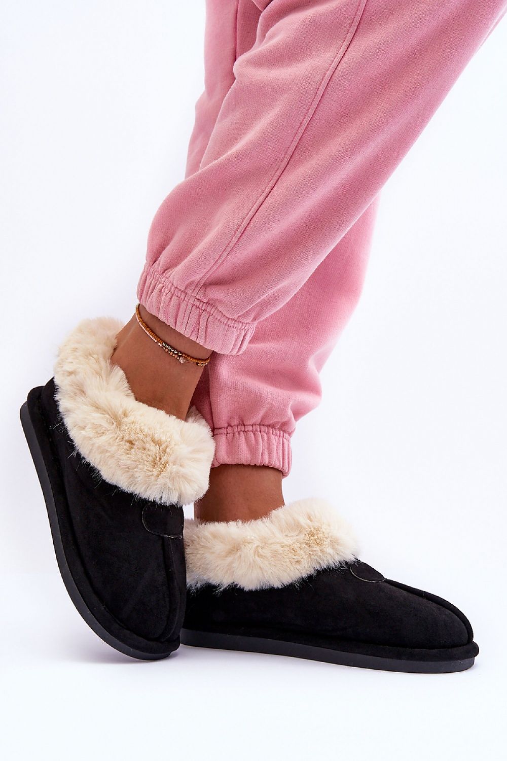 Sumptuous slip-on slippers by Step in Style, designed for warmth and comfort at home with an elegant eco suede finish and plush fur lining.