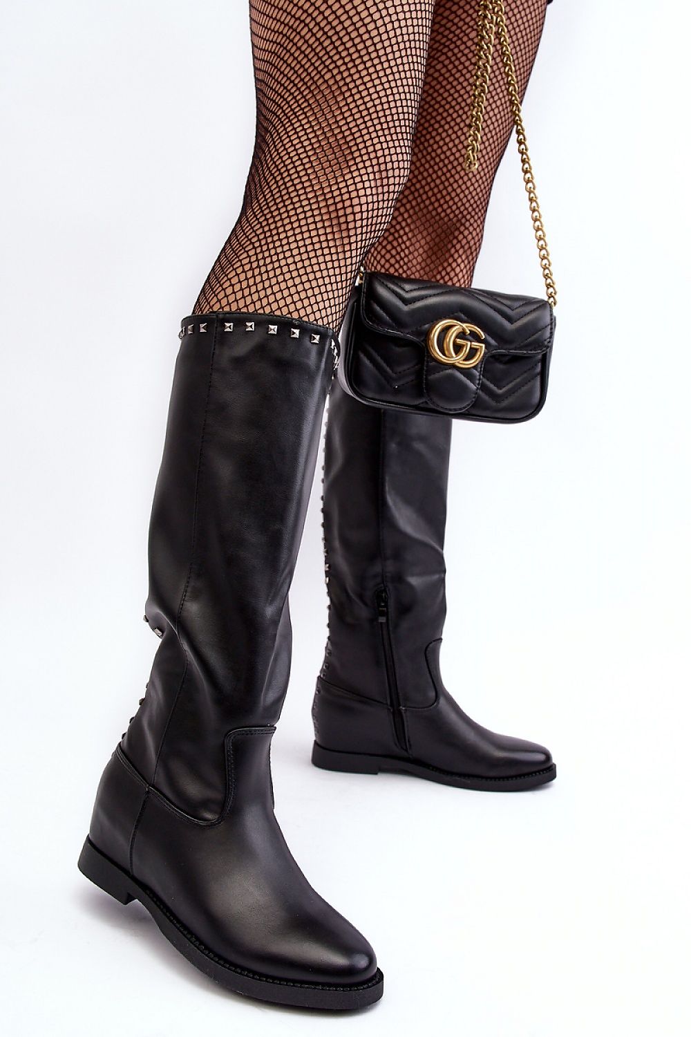 Luxurious women's thigh-high eco leather boots by Step in Style, featuring stylish studs, almond toe, and convenient slip-on design.