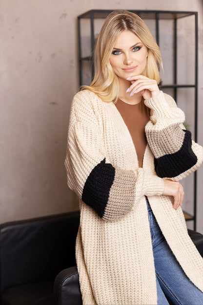 PeeKaBoo chic cardigan layered over stylish attire, enhancing a sophisticated wardrobe.