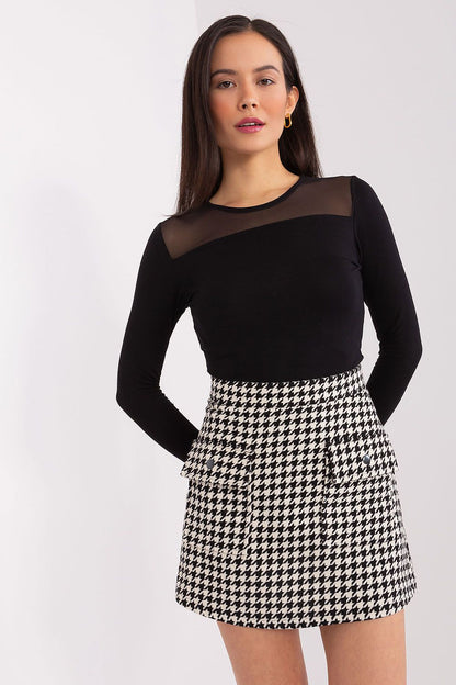 Elegant Lakerta Mini Skirt showcasing a peptique pattern, perfect for versatile styling in luxury women's fashion.