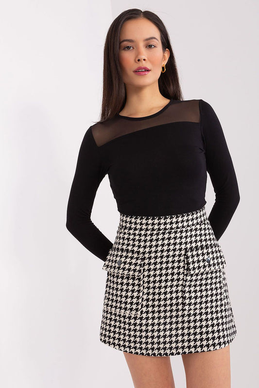 Elegant Lakerta Mini Skirt showcasing a peptique pattern, perfect for versatile styling in luxury women's fashion.