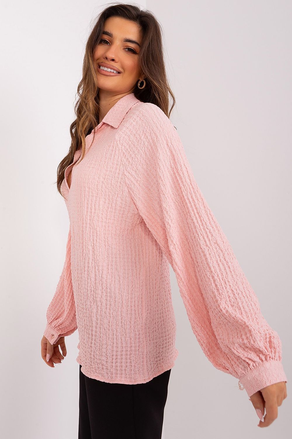 Elegant Lakerta Blouse featuring unique variegated texture, V-neckline, and long buff sleeves, epitomising sophistication and versatility for stylish occasions.