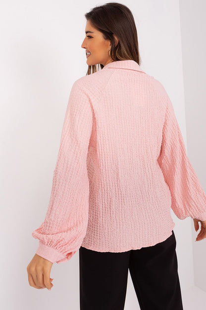 Elegant Lakerta Blouse showcasing its unique variegated texture, featuring a flattering V-neck and long buff sleeves, perfect for an upscale wardrobe.