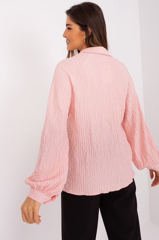 Elegant Lakerta Blouse showcasing its unique variegated texture, featuring a flattering V-neck and long buff sleeves, perfect for an upscale wardrobe.