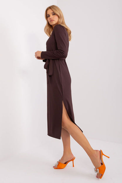 Close-up of Lakerta Elegant Midi Dress showcasing its ribbed fabric and modern silhouette with elegant cutout detail.