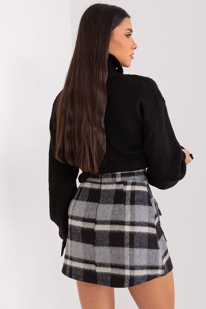 Model wearing the stunning Lakerta checkered mini skirt, perfectly styled for both casual outings and sophisticated events.