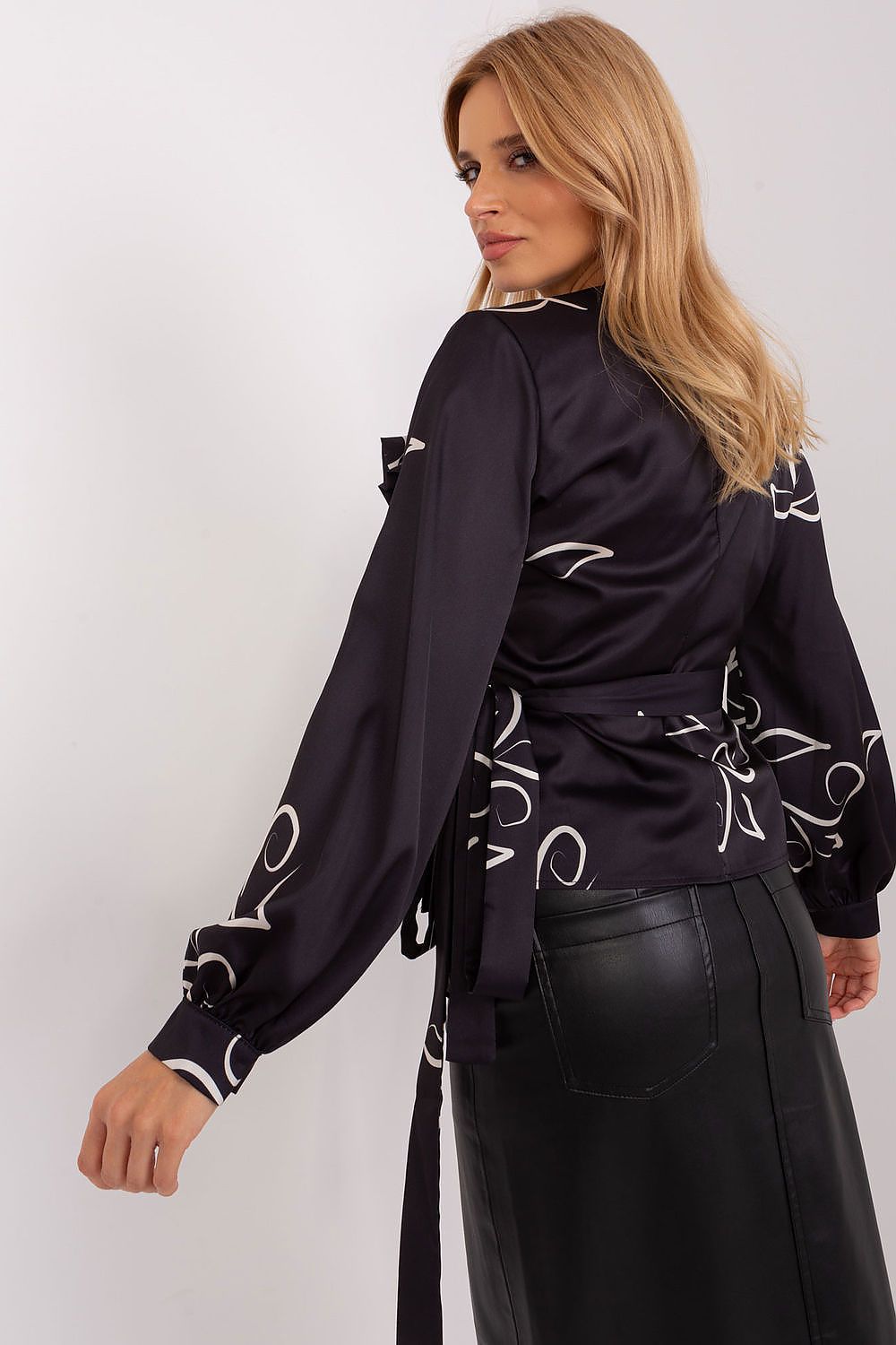 Stylish Luxury Lakerta formal blouse featuring an elegant envelope front and heart neckline, designed with intricate patterned fabric for a sophisticated look.