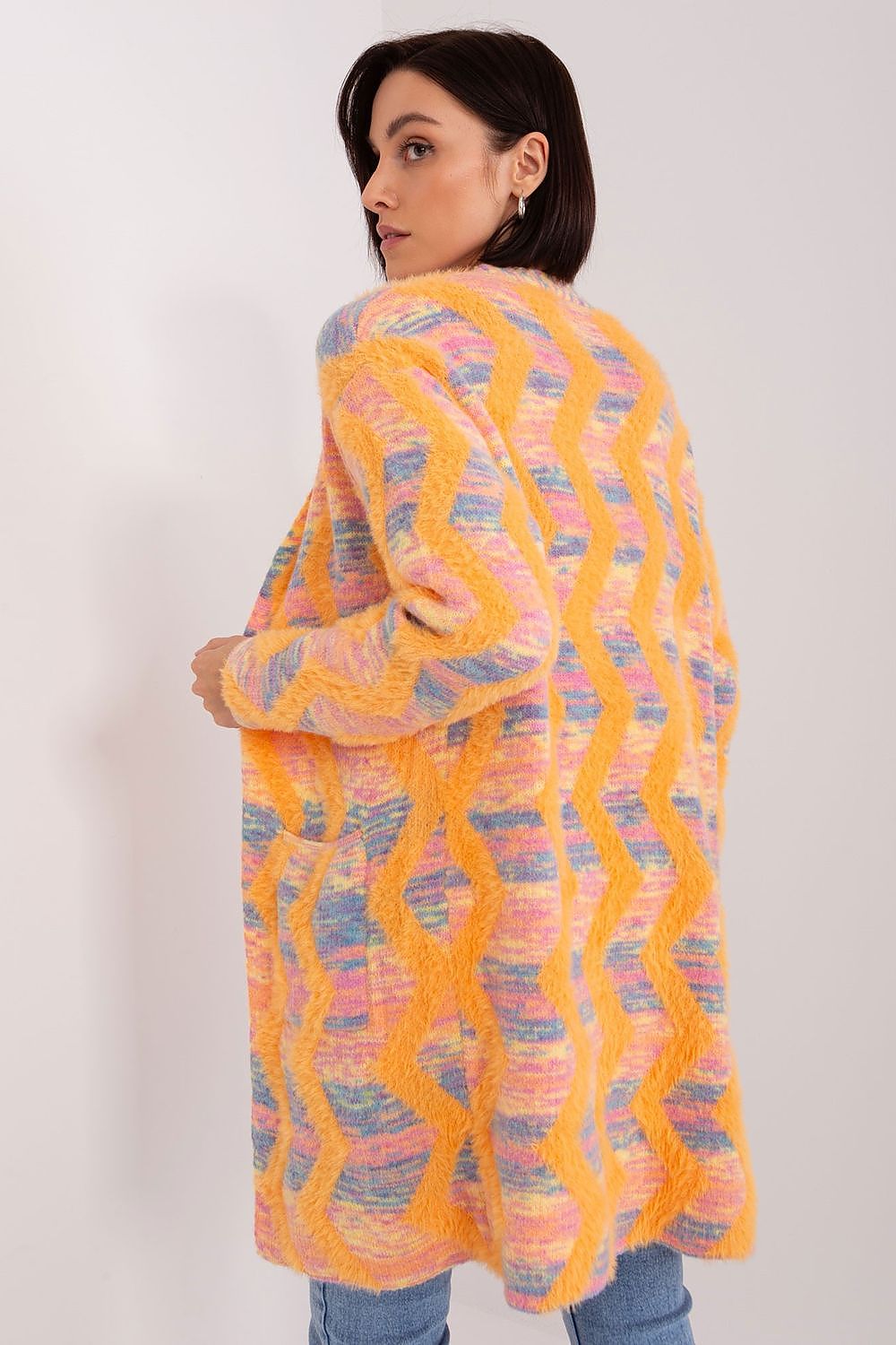 Detail shot of AT's geometric pattern long sleeve cardigan, highlighting its luxurious material and stylish design.