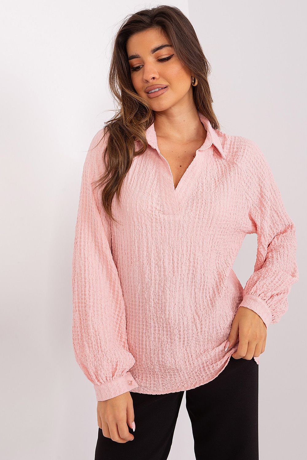 Luxurious Lakerta Blouse draped elegantly, highlighting its sophisticated design with a versatile style suitable for both office and evening wear.