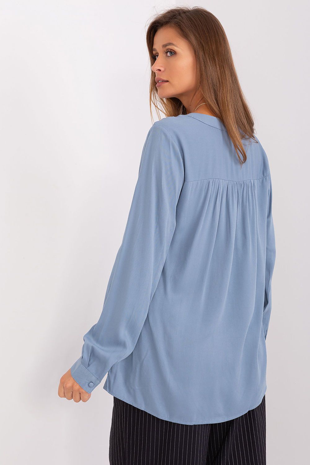 Sublevel's luxurious Viscose Blouse designed for effortless elegance, showcasing a flattering V-neck and stylish long sleeves.