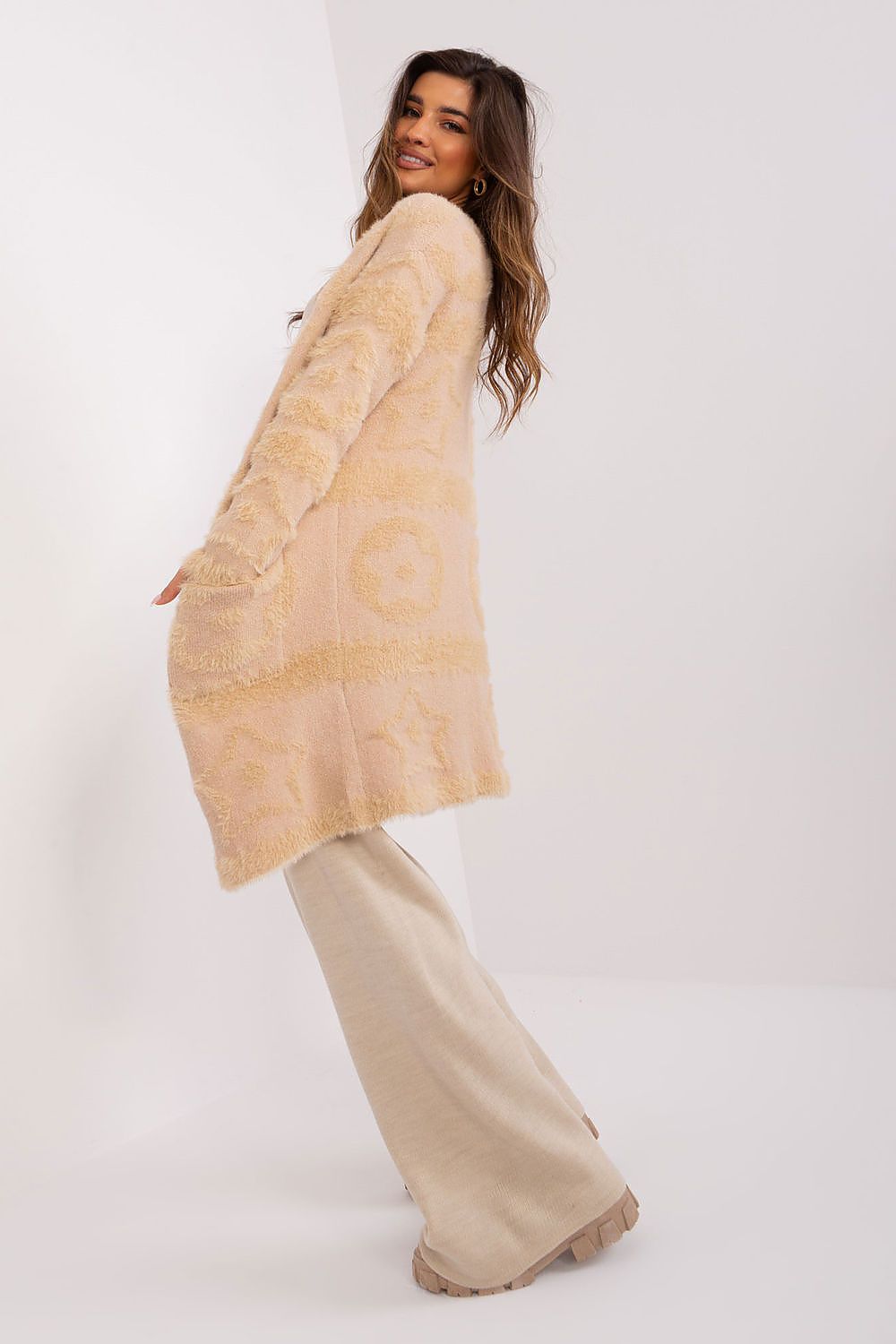 Elegant unbuttoned long sleeve cardigan by AT featuring varied textures, perfect for stylish everyday wear.