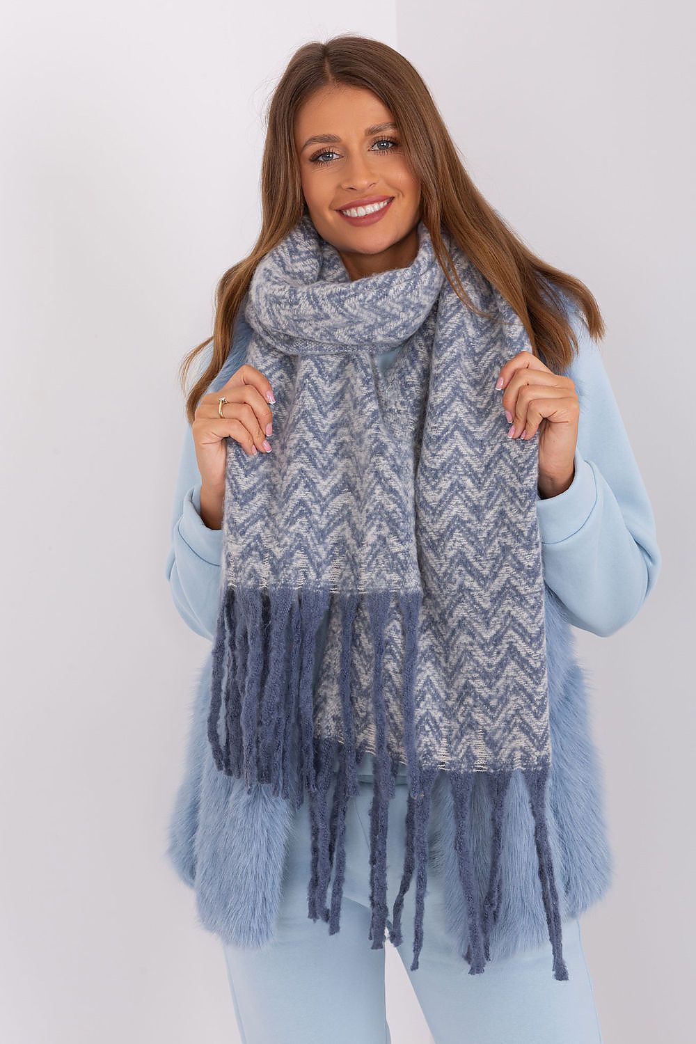 Stylish geometric design scarf in durable polyester by AT, perfect for fall and winter, adorned with elegant tassels.