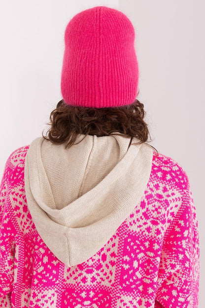 Close-up view of the exquisite braided pattern and unique front application on a winter warm hat by AT, crafted from premium acrylic and angora blend.