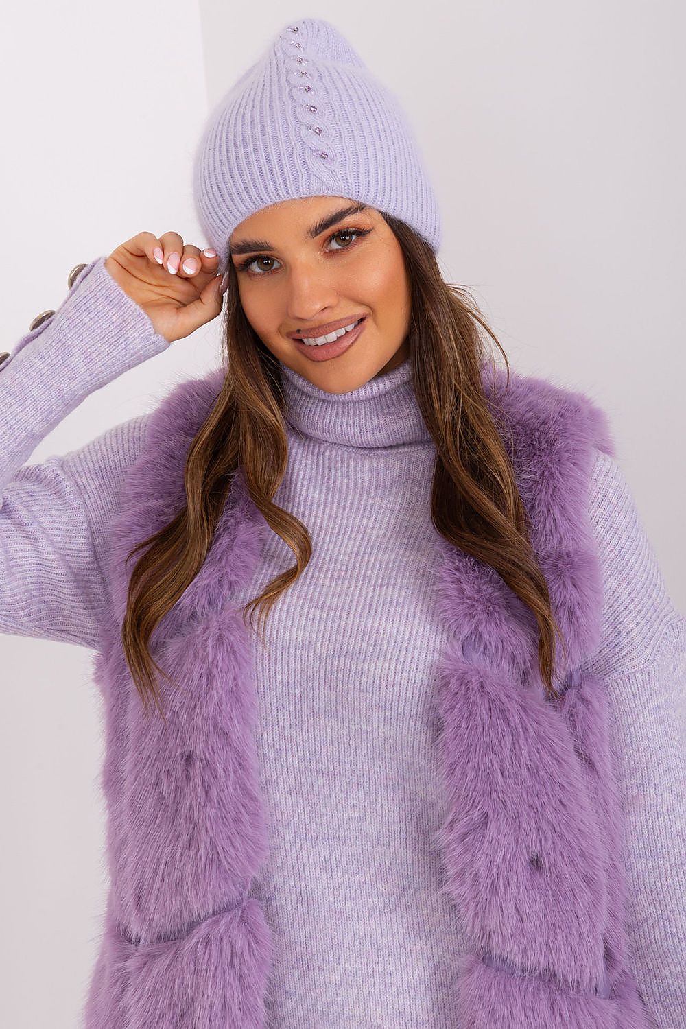 Beautifully styled winter hat by AT with a sophisticated braided pattern, perfect for cold weather, made with high-quality acrylic and angora.