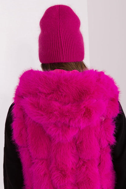 AT's exquisite winter hat featuring a distinct application and intricate braiding, crafted from a blend of acrylic and angora for a luxurious finish.