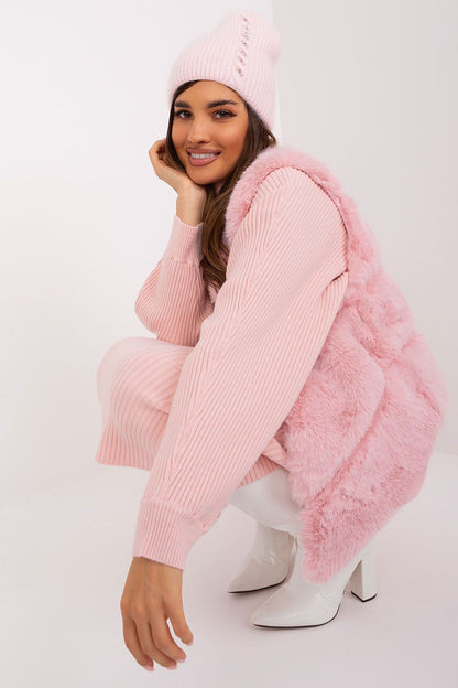 Fashionable winter hat offered by AT, elegantly designed with a braided motif and unique front detailing, composed of 60% acrylic and 40% angora for refined warmth.