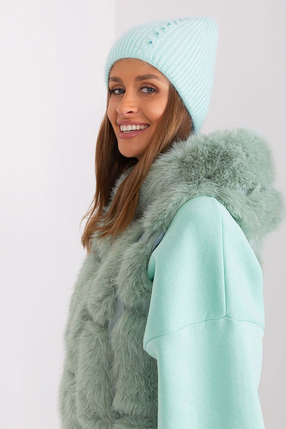 Stylish winter hat by AT with intricate braided design and exclusive decorative front, crafted from high-quality 60% acrylic and 40% angora.